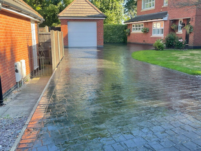 Pattern imprinted concrete driveway resealing in Northenden Manchester